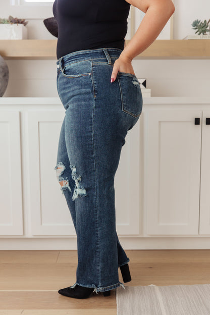 Your best outfits start with the Rose High Rise 90's Straight Jeans! Featuring a stretchy, dark wash denim that shapes a high rise waist with five pocket cut and zipper fly. 90's Straight cut pant legs end with chewed hems with distressing at the knees. 0-24-24W