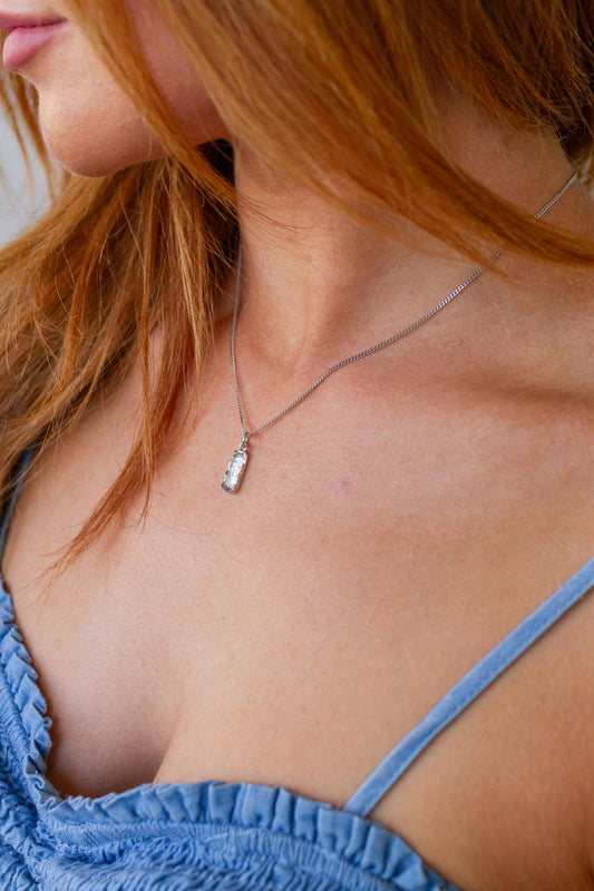 Achieve a timeless look with this Rustic Silver Pendant Necklace! The beautiful, hammered pendant hangs from a box chain for a classic finish. Perfect for any occasion, this necklace will be a staple in your jewelry collection!