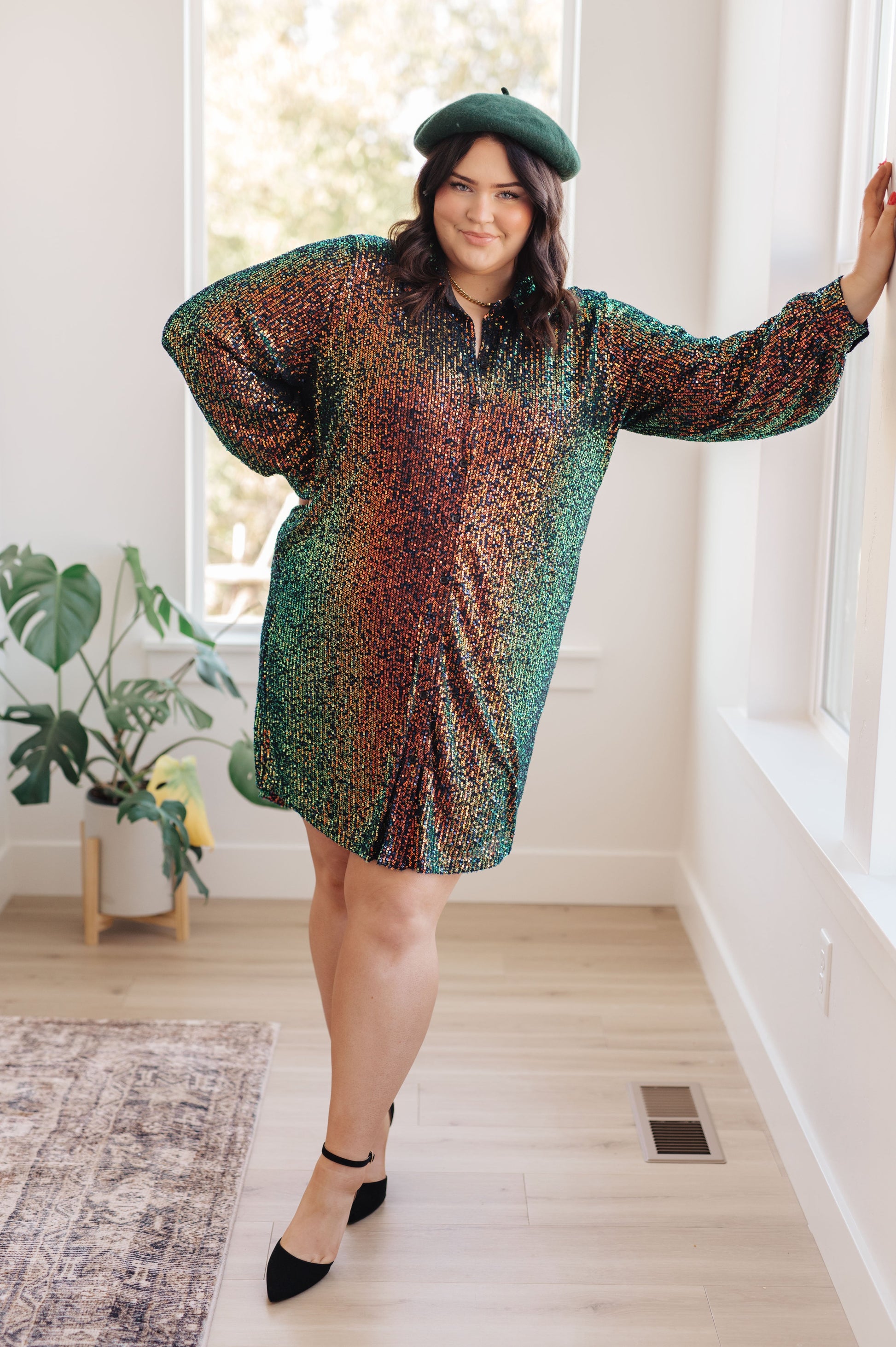 This Shimmering Splendor Sequin Shirt Dress is the perfect statement piece for any occasion. Featuring a collared neck, long sleeves and buttoned cuffs, you can feel confident that you'll look fabulous. The sequins give you an eye-catching shimmer that will make you shine brighter than anyone else in the room. S -3X