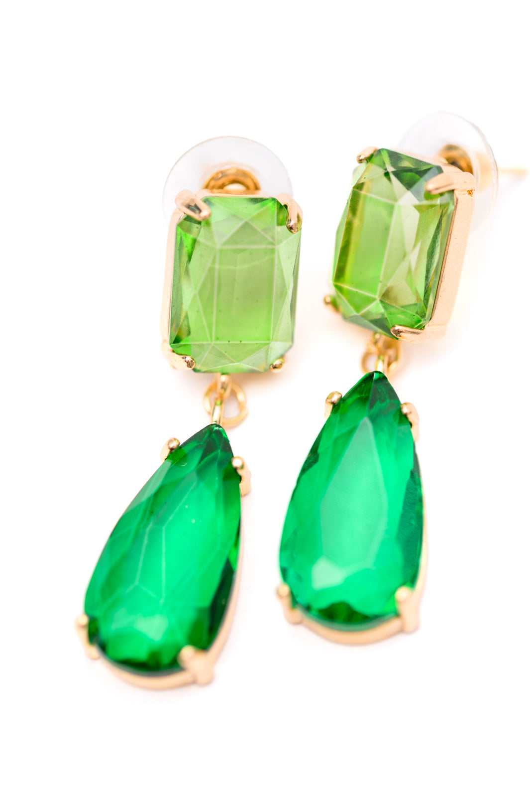 Make a stylish statement with these Sparkly Spirit Drop Crystal Earrings. Featuring mounted crystal stones and post earrings, they provide a stunning pop of color for any look.
