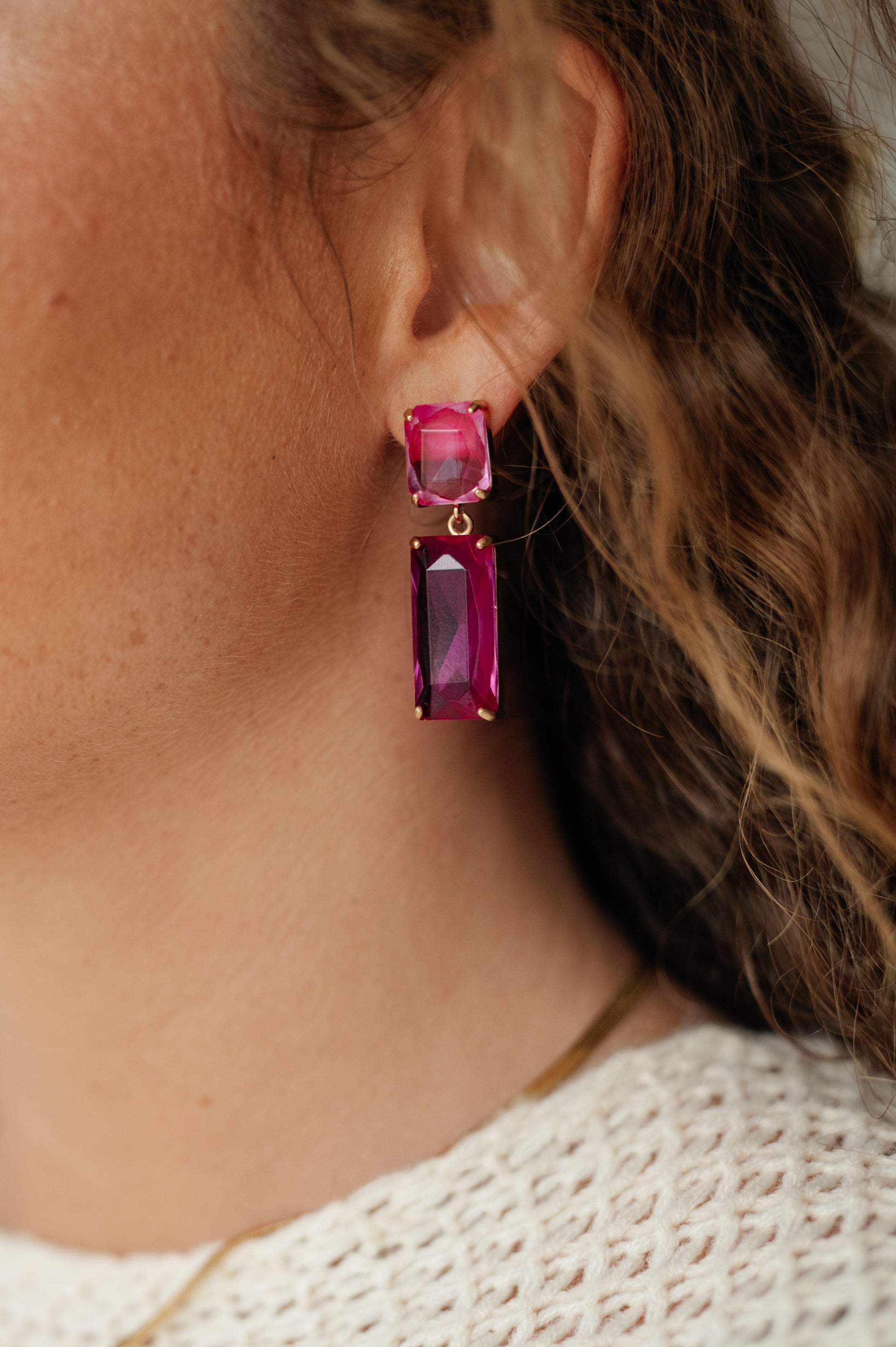 Make a stylish statement with these Sparkly Spirit Drop Crystal Earrings. Featuring mounted crystal stones and post earrings, they provide a stunning pop of color for any look.