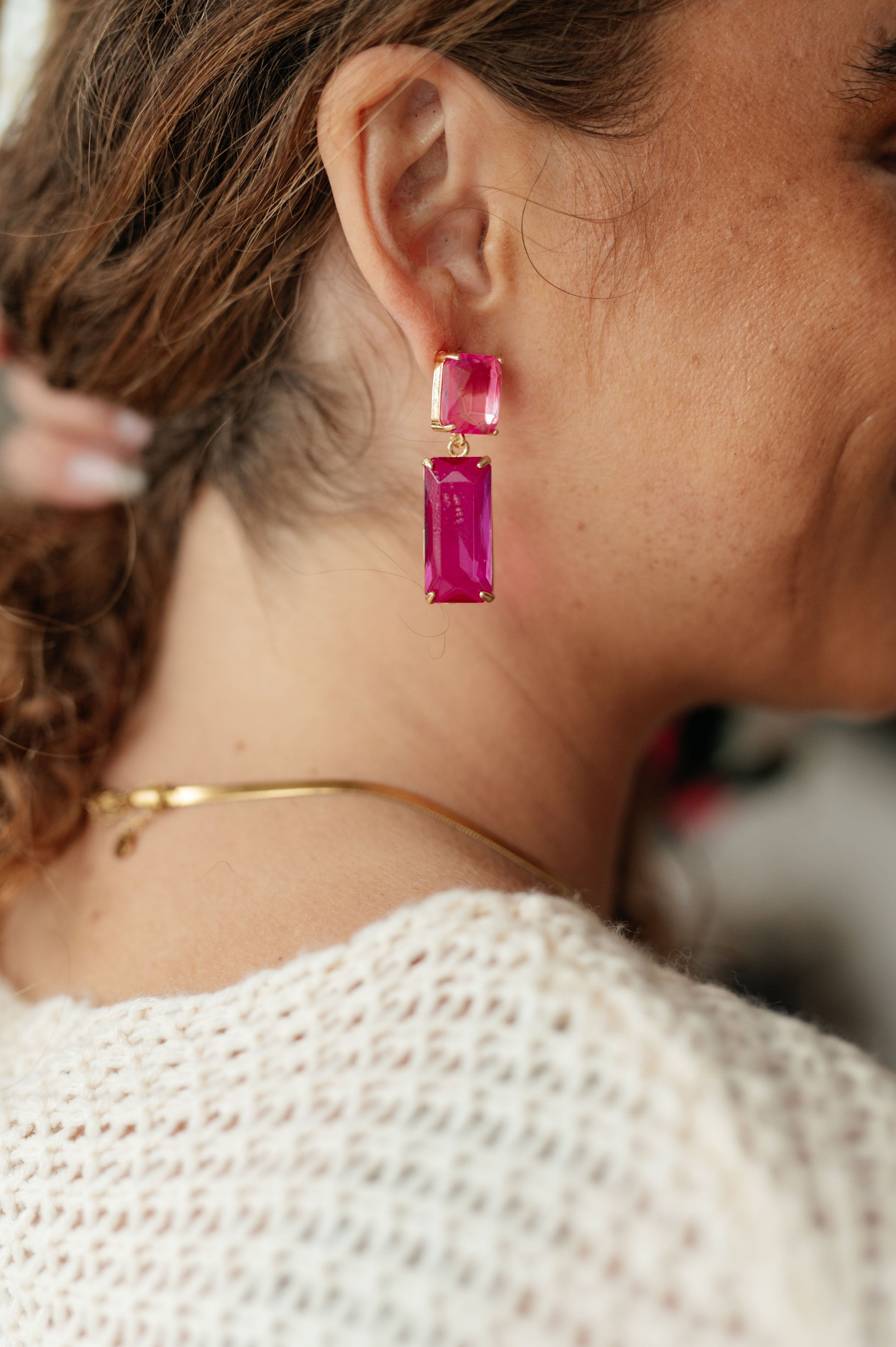 Make a stylish statement with these Sparkly Spirit Drop Crystal Earrings. Featuring mounted crystal stones and post earrings, they provide a stunning pop of color for any look.