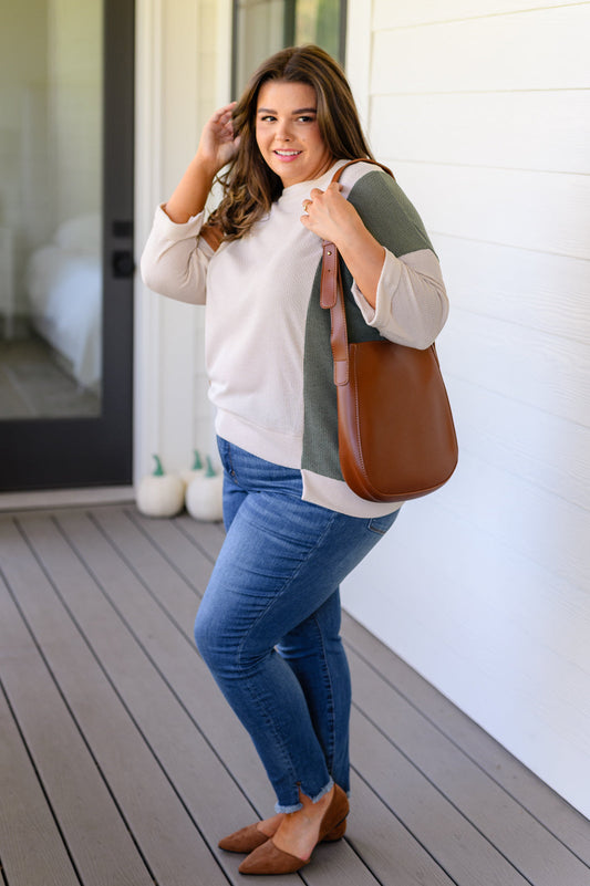 The Take the Best Shoulder Bag is the perfect accessory for the modern go-getter. Crafted from faux leather, its scoop shaped tote design is paired with a sleek, matching zippered pocket with wristlet, and adjustable strap for maximum comfort. Upgrade your style today!