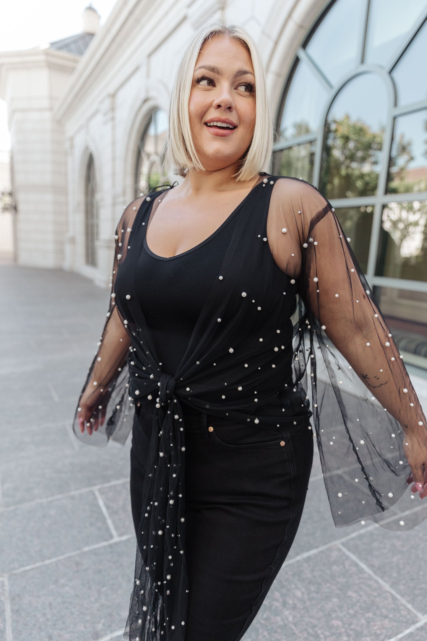 This Sprinkle of Pearls Sheer Kimono is a timeless addition to your wardrobe. Sheer mesh is dotted with faux pearls for a subtle hint of sparkle. This chic kimono has an open front with an optional tie front to flatter your figure. Long sleeves complete the look.