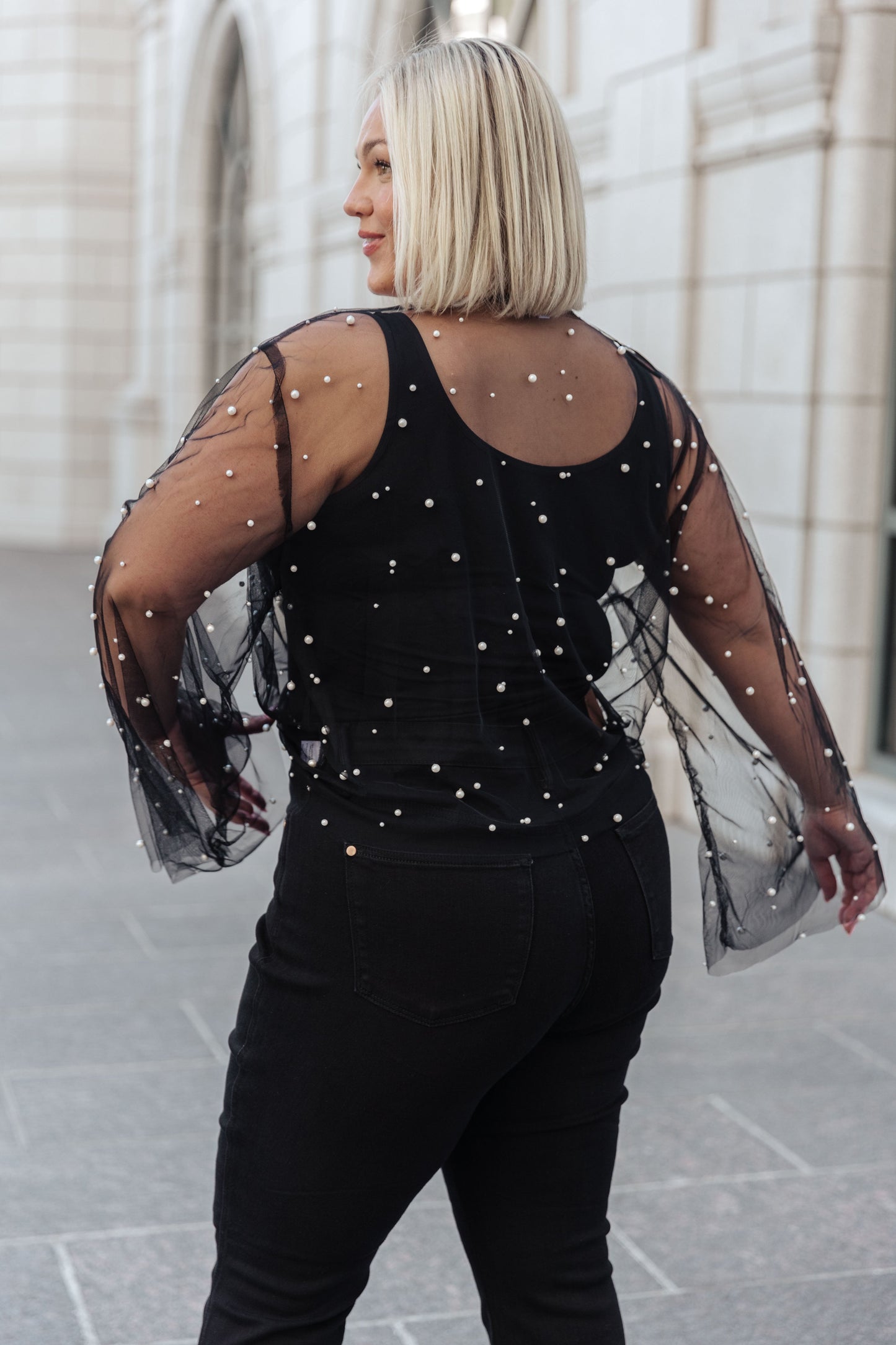 This Sprinkle of Pearls Sheer Kimono is a timeless addition to your wardrobe. Sheer mesh is dotted with faux pearls for a subtle hint of sparkle. This chic kimono has an open front with an optional tie front to flatter your figure. Long sleeves complete the look.