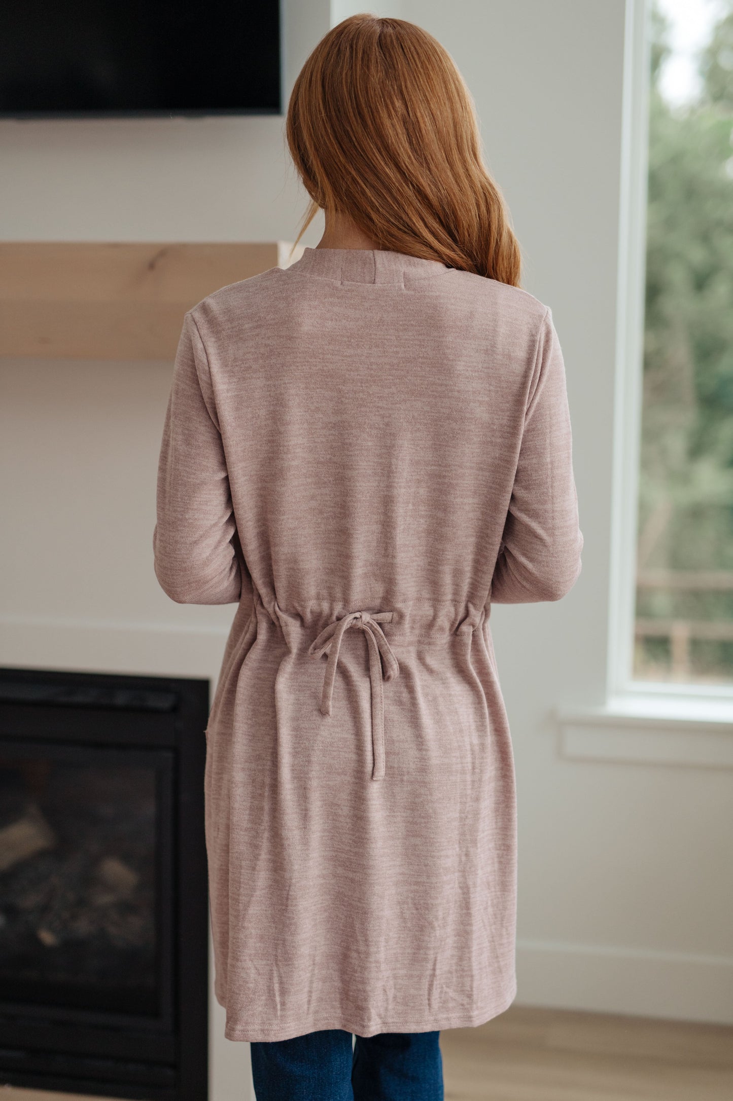 Our Staying Hopeful Cardigan is the perfect lightweight layer to add to your wardrobe. It features a sweater knit construction and an open front, with a drawstring in the back to cinch the waist for a more flattering shape. Perfect for cool days and evenings. S - 3X