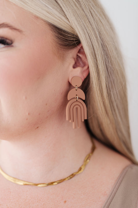 Wear this lovely pair of earrings as a reminder of all the good that is coming to you! This Promise Earrings in Brown, symbolic of a rainbow and new beginnings, the bold yet classic accessory you’ve been waiting for. Handmade with durable plastic, these beauties have the appearance of clay for a timeless finishing touch to every outfit. 