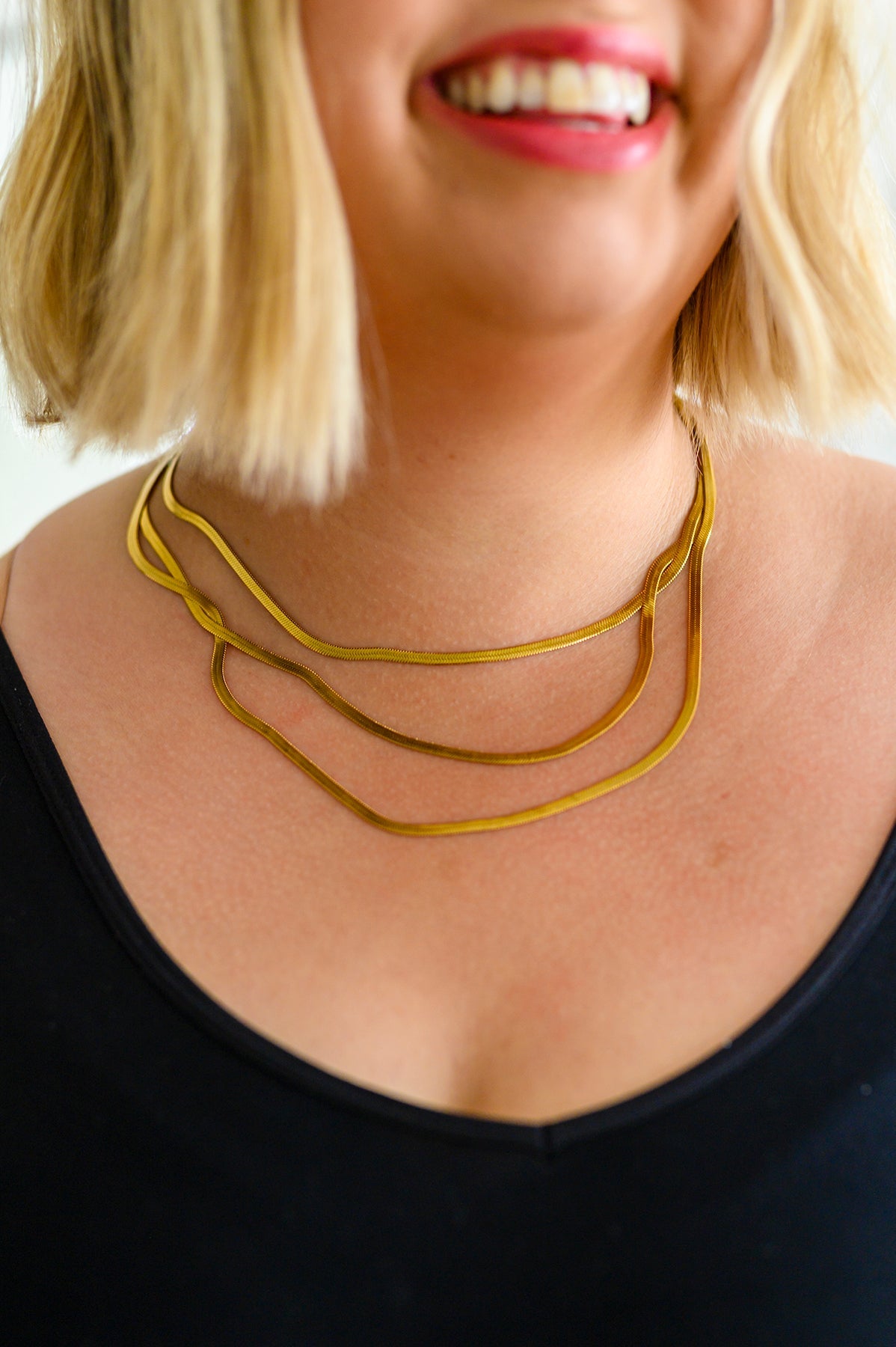 This Three is Better Than One Layered Necklace is an effortless way to add timeless class to any outfit. Featuring three gold plated snake chain strands in a layered design, it's the perfect statement piece for any occasion. Get ready to wow!