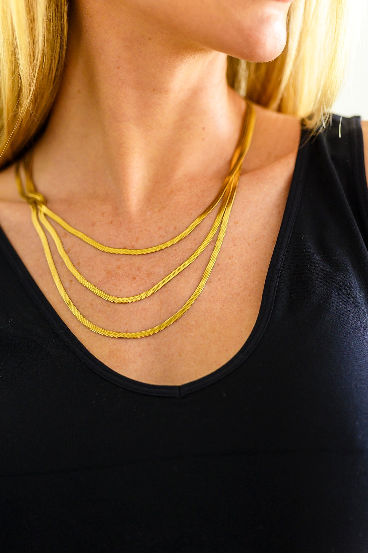 This Three is Better Than One Layered Necklace is an effortless way to add timeless class to any outfit. Featuring three gold plated snake chain strands in a layered design, it's the perfect statement piece for any occasion. Get ready to wow!