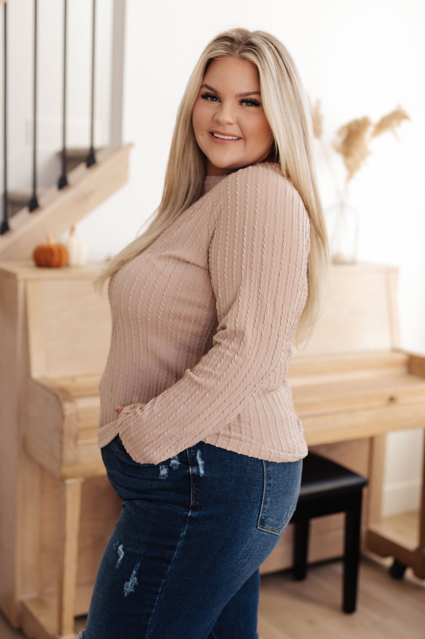 Soothe your senses in this Winding Down Cable Detail Top. A textured knit with raglan sleeves and round neckline will keep you feeling comfortable and stylish. Enjoy the luxurious softness of this timeless piece. S - 3X