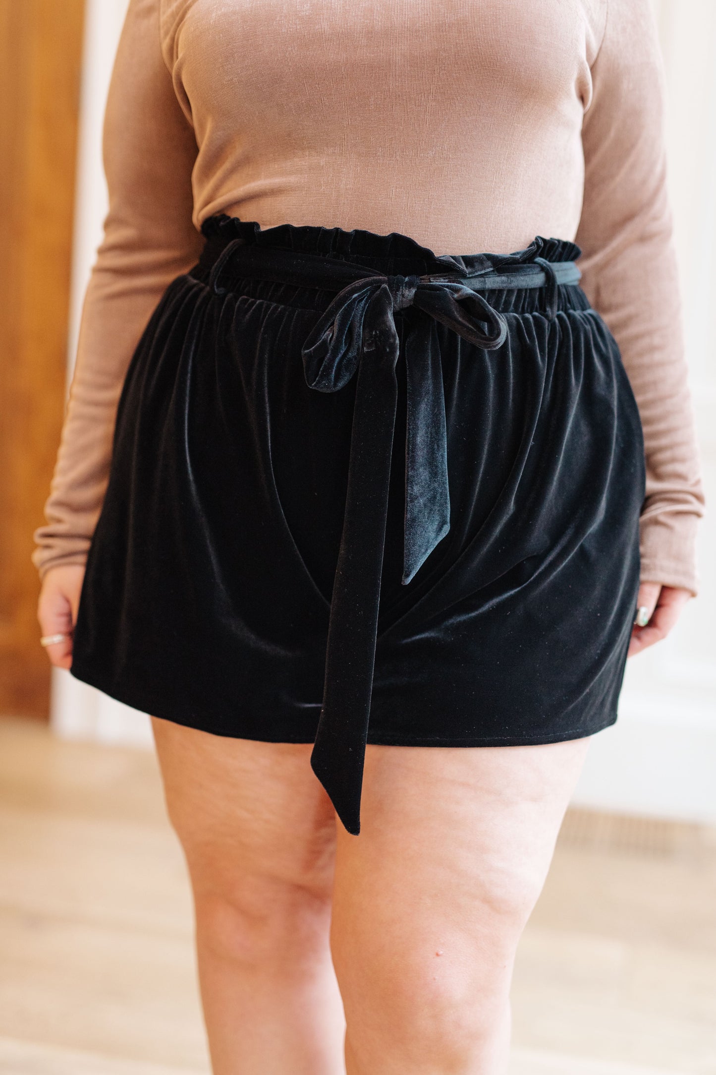 Fall in love with our luxurious Wrapped in Velvet Shorts! Featuring a high rise, these silky black velvet shorts have a gathered elastic paper bag waistband and self tie belt for an adjustable fit. Stylish pockets add the perfect touch. Feel confident and beautiful in these oh-so-comfy shorts! S - 3X