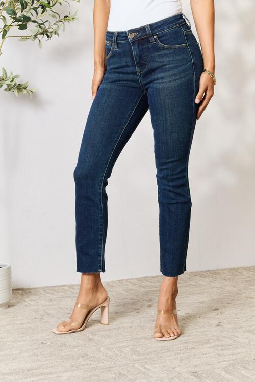 Raw hem straight jeans are a trendy and modern choice, featuring a frayed and undone hemline that adds a touch of edginess to any outfit. These jeans offer a carefree and relaxed vibe, perfect for pairing with a casual tee or a dressy blouse for a versatile and fashion-forward look.