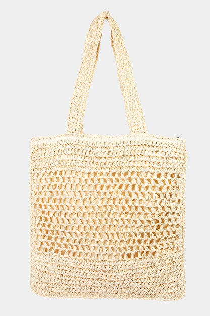 Straw-Paper Crochet Tote Bag is a stylish and eco-friendly accessory that combines the natural look of straw with the durability of paper crochet. The intricate crochet design adds a touch of artisanal craftsmanship to the bag.