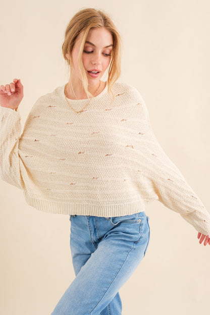The Dolman Sleeves Sweater is a cozy and stylish addition to your wardrobe, perfect for the cooler months. The relaxed fit and dolman sleeves create a comfortable and effortless look that is both trendy and versatile. Crafted from soft and warm materials, this sweater is ideal for layering over a camisole or wearing on its own.