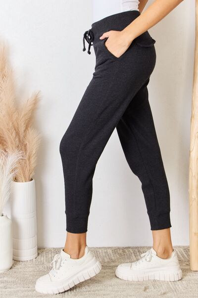 These joggers offer unparalleled comfort for lounging at home or running errands in style. The relaxed, yet tailored fit ensures maximum comfort without compromising on looks, while the elastic waistband provides a customizable fit for all-day wear. S - XL