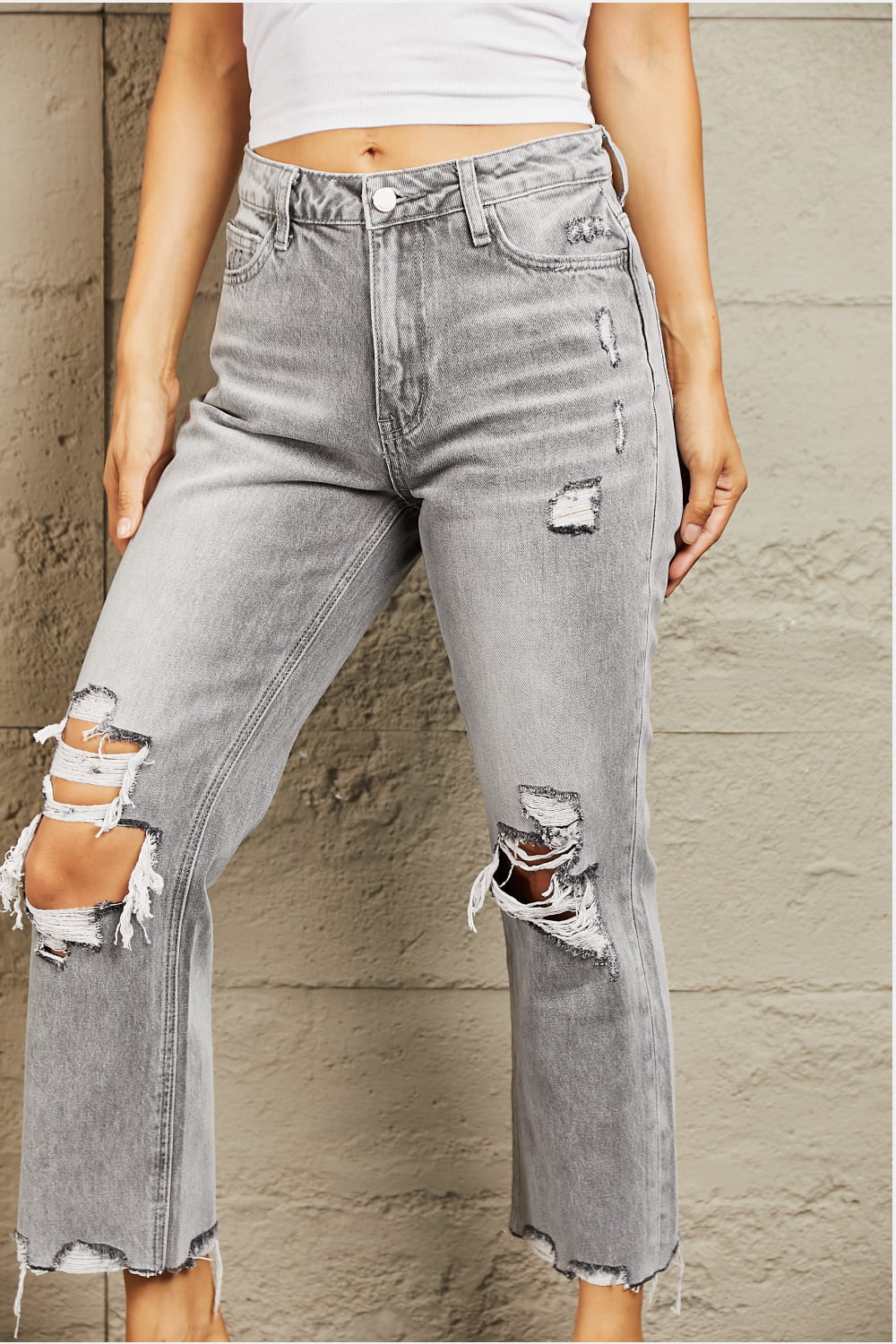 These jeans are crafted from premium quality denim, ensuring a soft and stretchy fit that flatters your curves while providing all-day comfort. The high waist design offers a flattering silhouette, while the trendy distressed details add a touch of edginess to your outfit. 