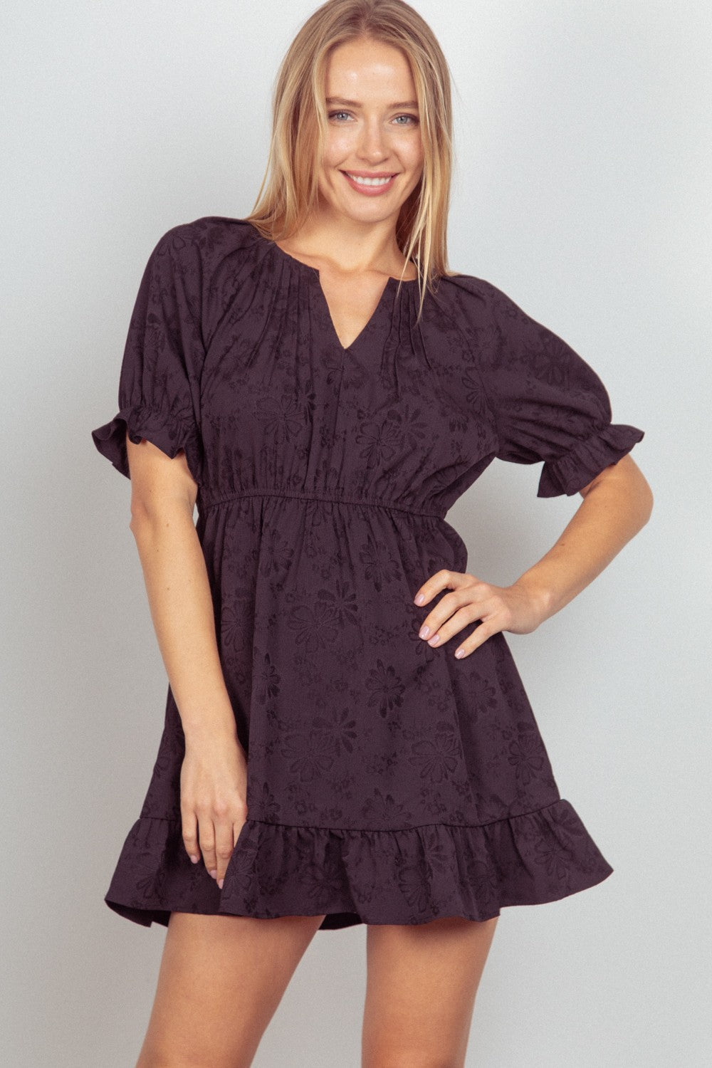 This Floral Textured Woven Ruffled Mini Dress is a charming and feminine choice for any special occasion. The floral textured fabric adds a romantic touch to the sweet ruffled details.  S  - L