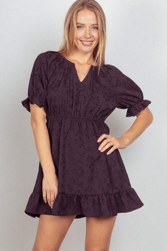 This Floral Textured Woven Ruffled Mini Dress is a charming and feminine choice for any special occasion. The floral textured fabric adds a romantic touch to the sweet ruffled details.  S  - L