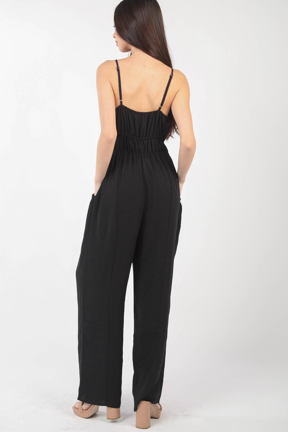 This Pintuck Detail Woven Sleeveless Jumpsuit is a chic and versatile piece for your wardrobe. The pintuck detailing adds a touch of sophistication to the sleeveless jumpsuit silhouette. Made from woven fabric, this jumpsuit offers a sleek and polished look. S - L