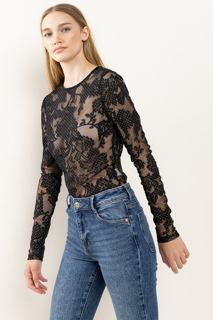 The Floral Lace Mesh Bodysuit features delicate lace detailing and a flattering mesh fabric. The intricate floral design adds a touch of femininity and elegance to any outfit. Perfect for a night out or a special occasion, this bodysuit offers a stylish look. S - L