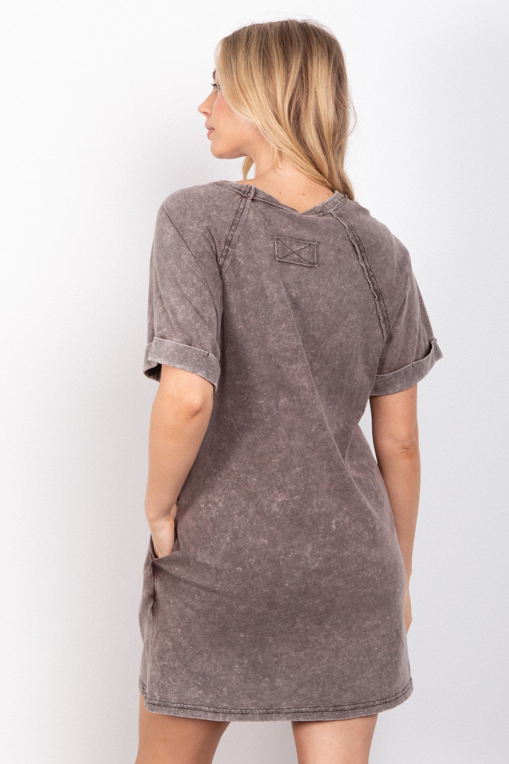 This Washed Round Neck Mini Tee Dress is a stylish and versatile piece for your casual wardrobe. The washed fabric gives it a soft and lived-in look, perfect for a laid-back vibe. With a classic round neck and mini length, this dress offers a simple yet flattering silhouette. S - L