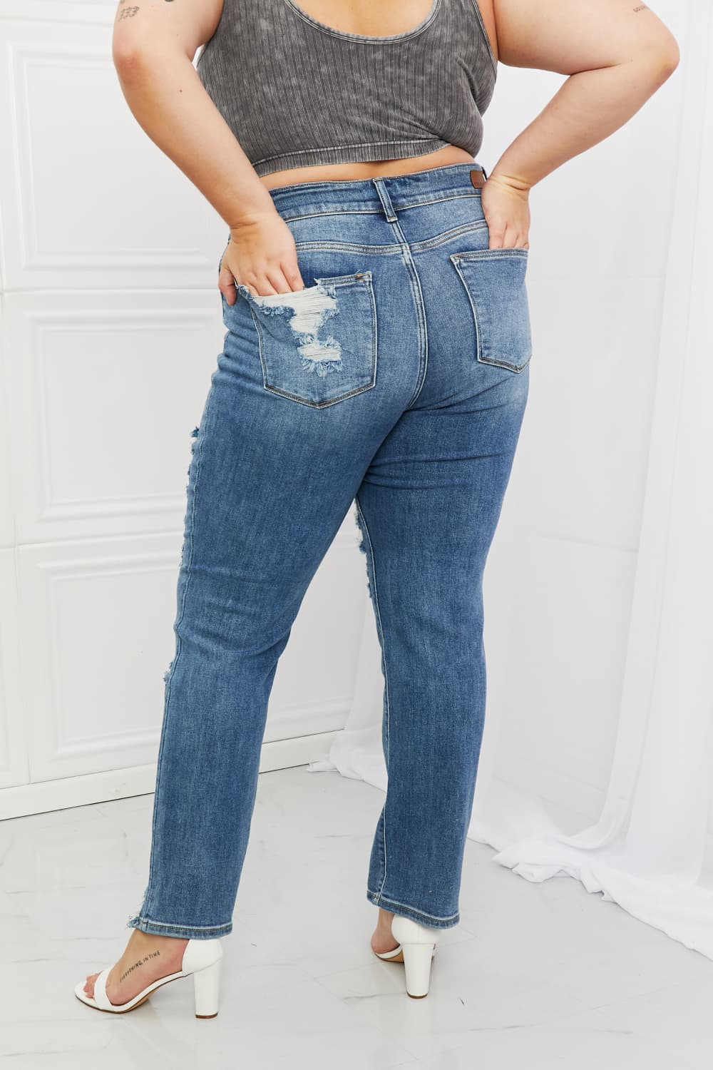 These jeans are the perfect combination of style and comfort, making them a must-have in every fashion-forward individual's wardrobe.The heavy distressing adds a touch of edginess to the classic straight-leg silhouette, making them perfect for a night out with the girls or a casual weekend brunch. 