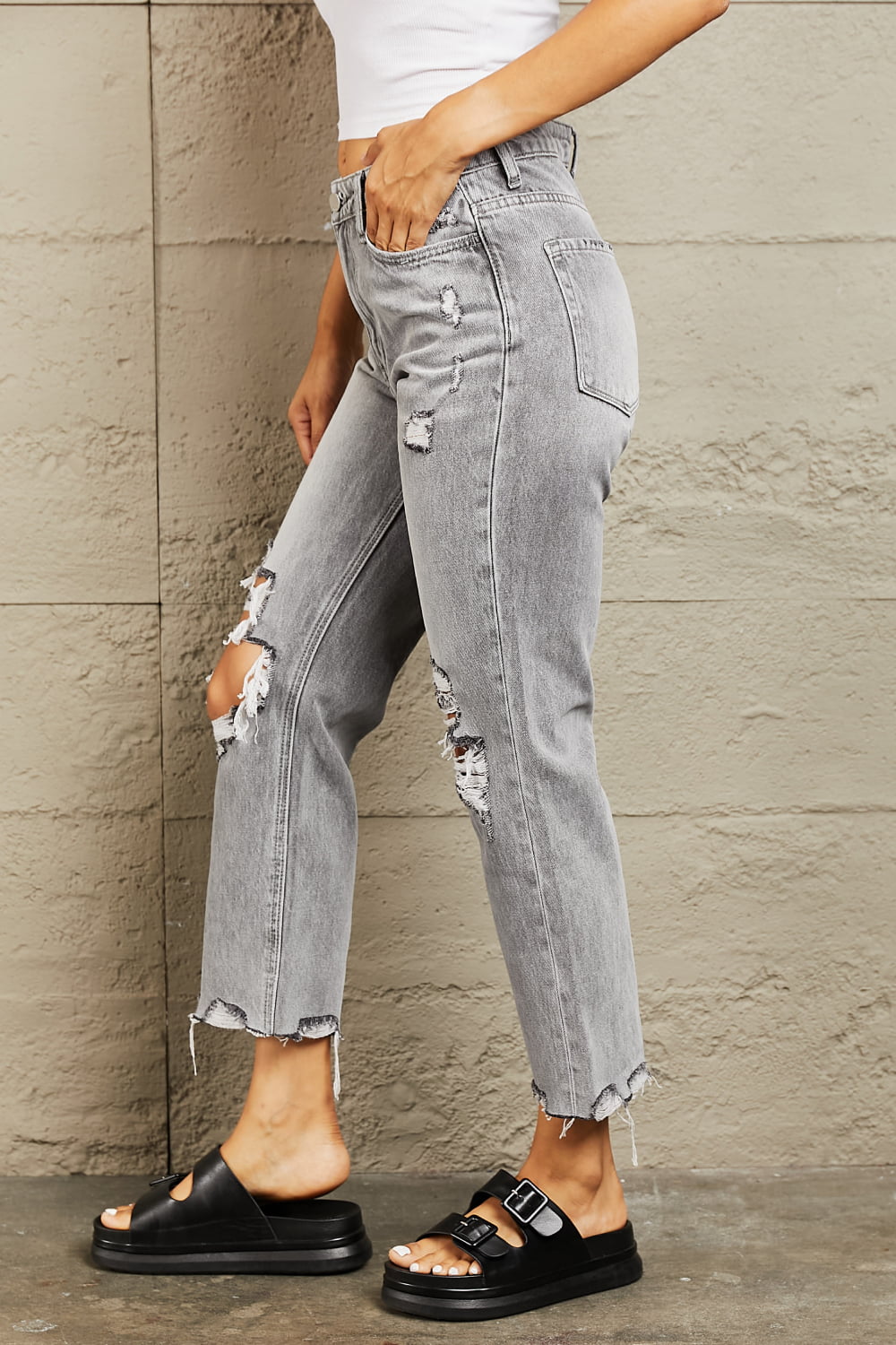 These jeans are crafted from premium quality denim, ensuring a soft and stretchy fit that flatters your curves while providing all-day comfort. The high waist design offers a flattering silhouette, while the trendy distressed details add a touch of edginess to your outfit. 